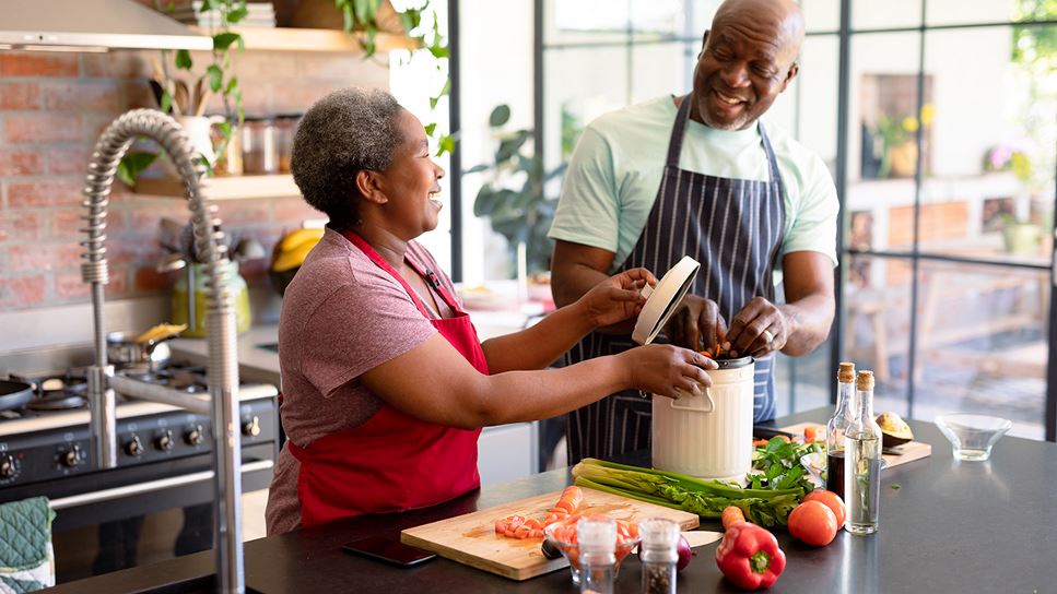 Couple prepares a meal using ingredients that are brain health-boosting foods